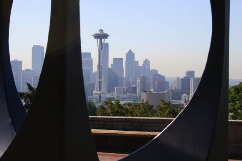 Seattle skyline through the holes of the Changing Form sculpture at Kerry Park