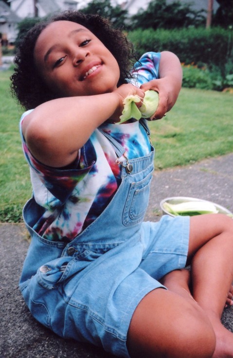 My daughter shucking sweet corn (photo 1996)