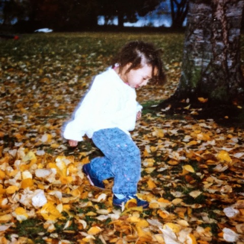 My daughter running through fall leaves, 1991
