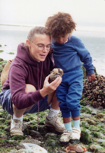 Wonders to behold, looking at a moon snail shell at Carkeek Park with my daughter, August 1991