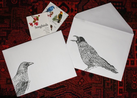 Ink sketches of crows decorate envelopes