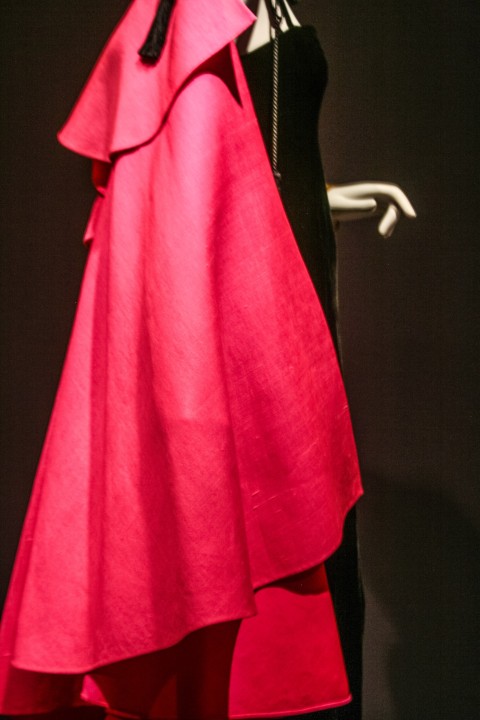 Pink ruffle cape over black sheath dress, 1977